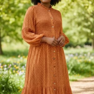 Women’s long orange dress with a subtle pattern and flowy sleeves, featuring an elegant and comfortable design